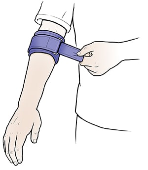 Person putting on splint tennis elbow splint, tightening it on arm just below elbow.