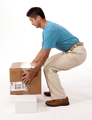 Person lifting box safely.